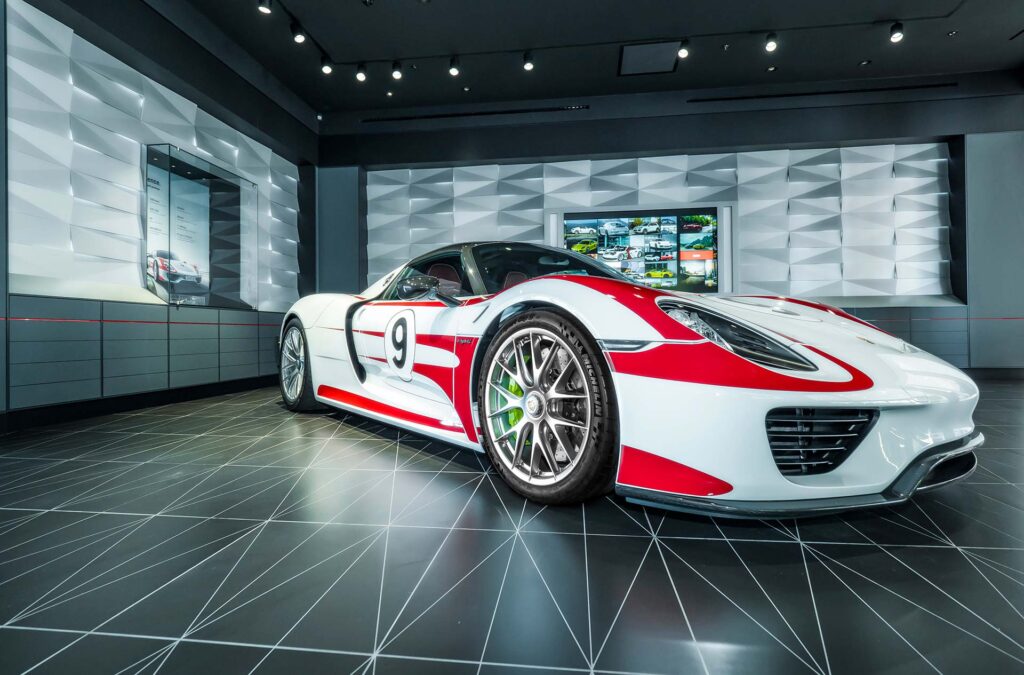 Porsche Car Retail Showroom interior design and build with interactive advertising screens installed