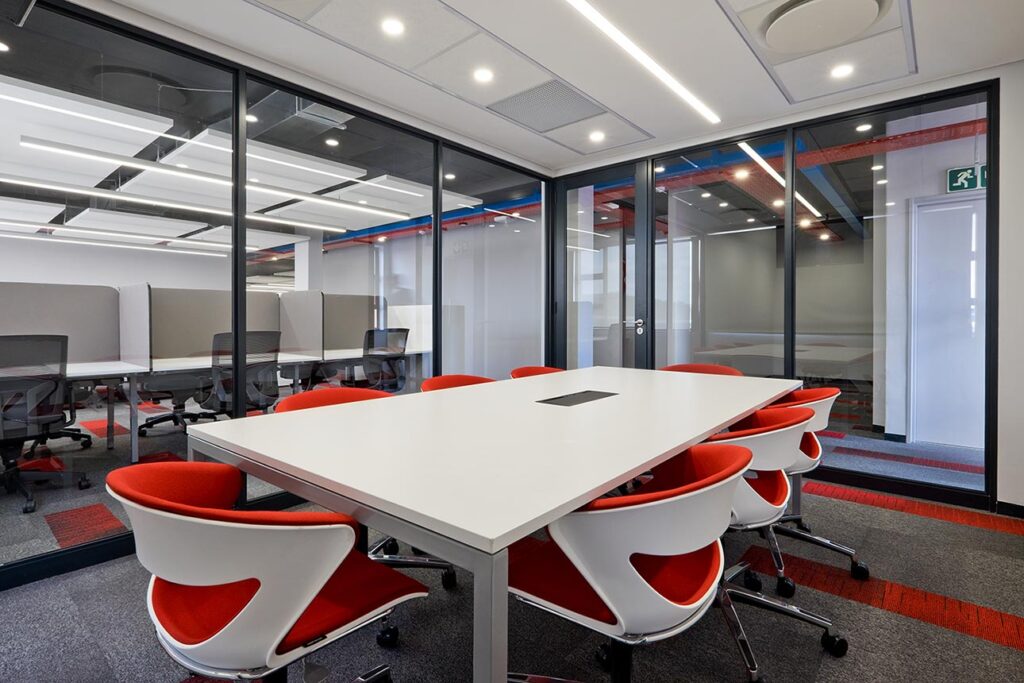 Coca-Cola global boardroom office design and fit-out with red chairs