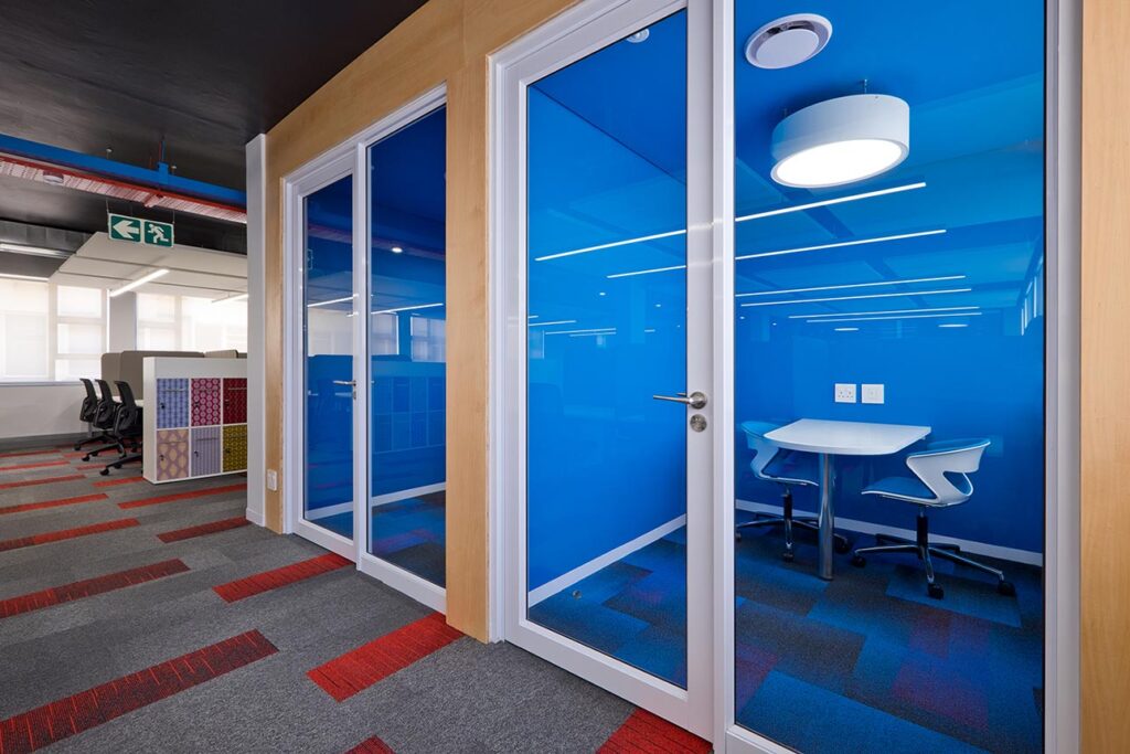 Coca-Cola commercial private office design with blue glass interiors