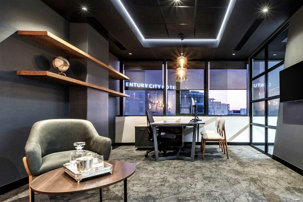 Informal meeting area with lounge chairs and pendant lighting for Search Projects Cape Town