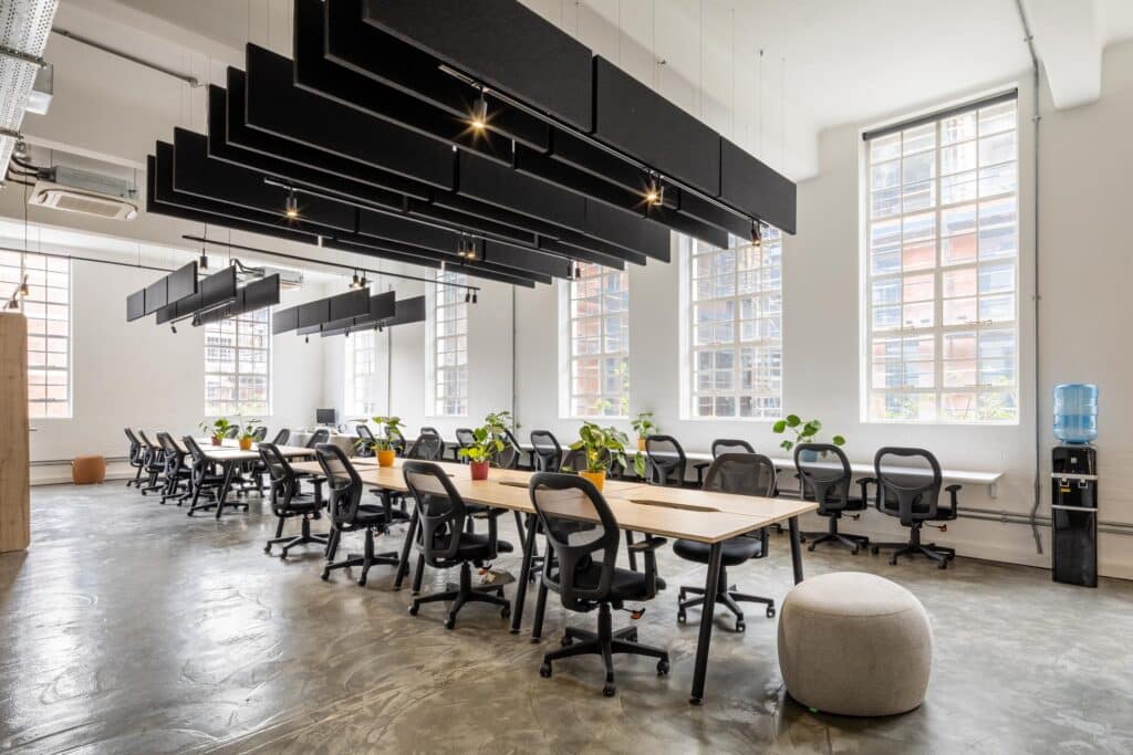 Cost Certified international modern office interior with open plan desks and chairs and plant design
