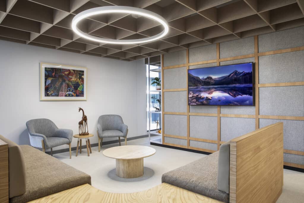 European Investment Bank international office breakaway meeting area with modern art and furniture fit-out