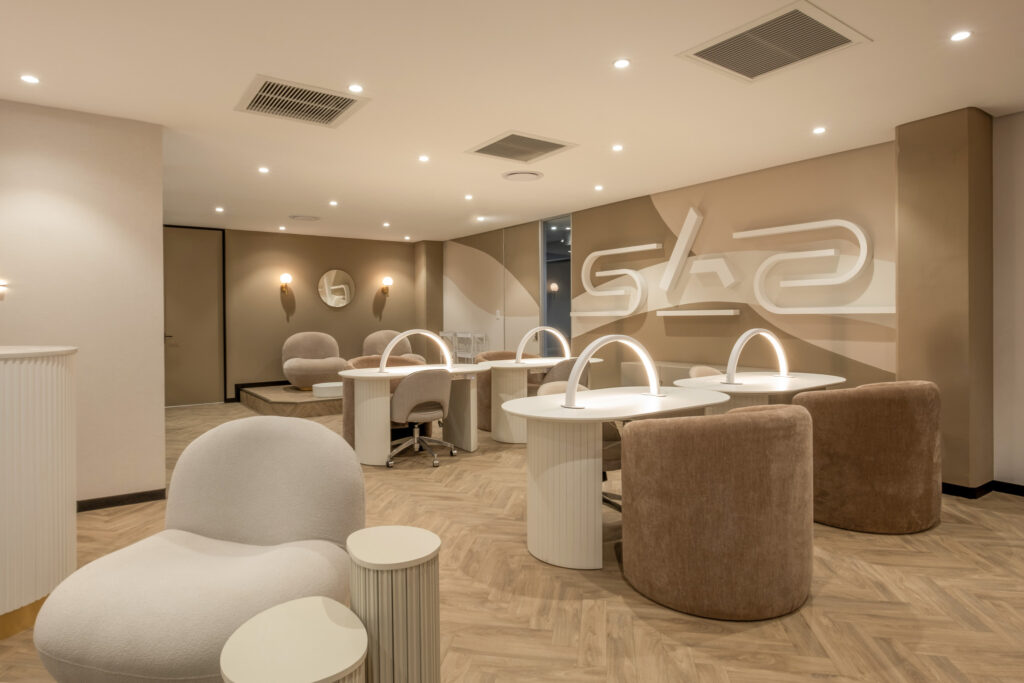 Treatment area with with pendant lighting, couches and tables for Afra Bel in Johannesburg