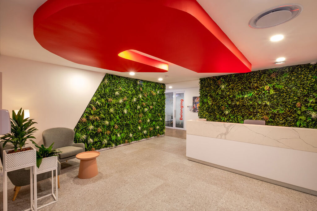Dynamic office environment reception area with green wall