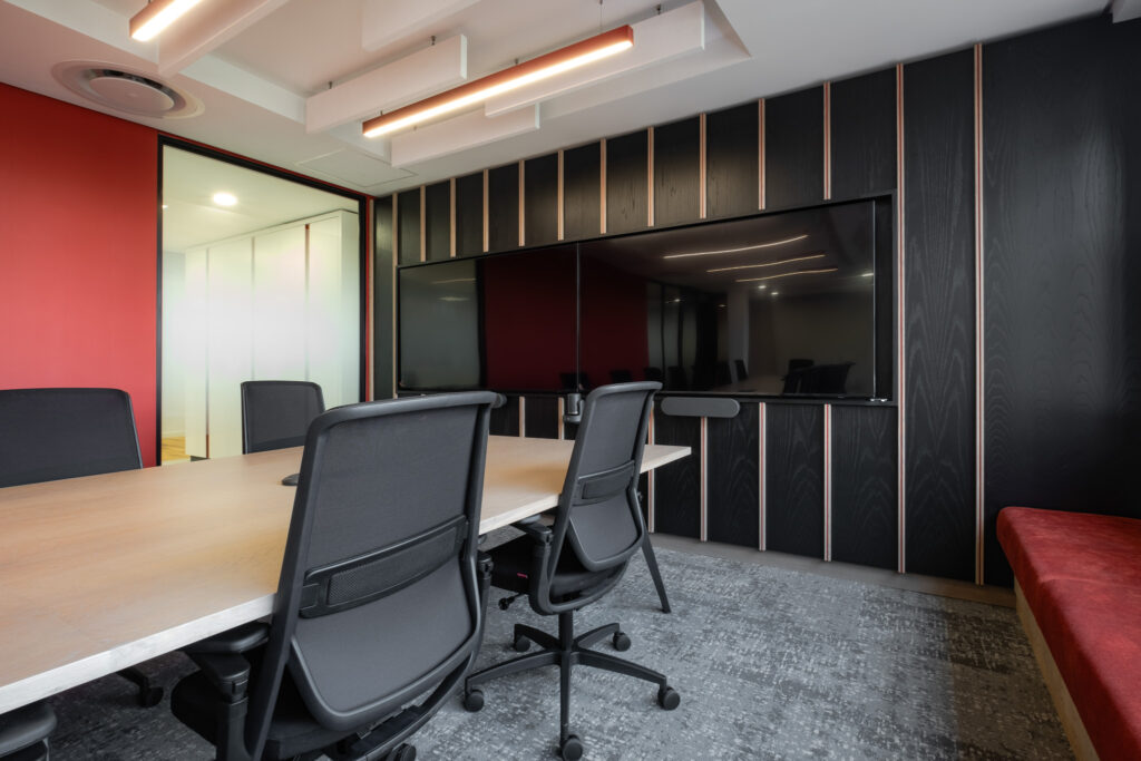 Boardroom with ergonomic chairs and linear lighting for Automation Client