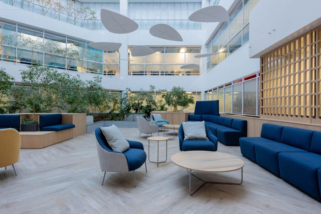 Capita international contact centre interiors with lounge reception area and floating acoustic feature design