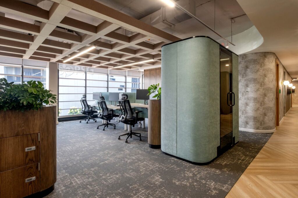 Workstations for modern office headquarters with planter and call pod