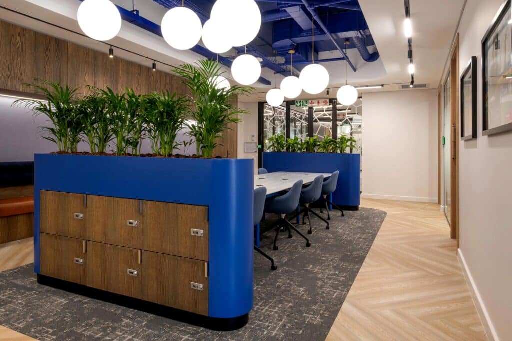 Bold colours in office with planter and contemporary furniture