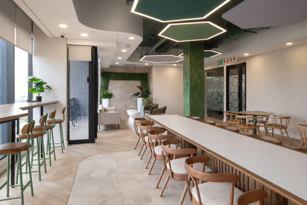 Workplace cafeteria featuring wooden contemporary furniture