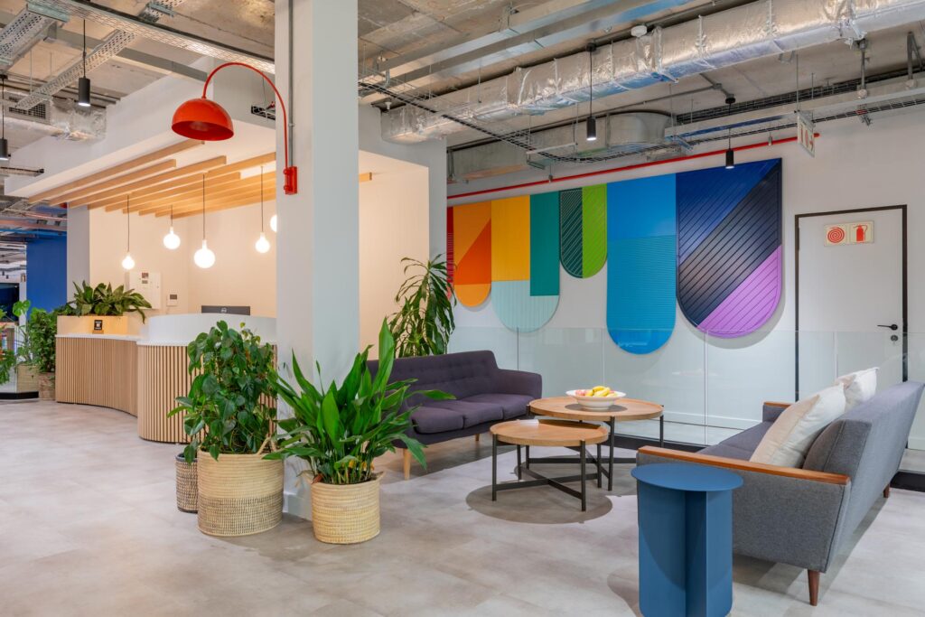 Waiting area with wall panel art and planters