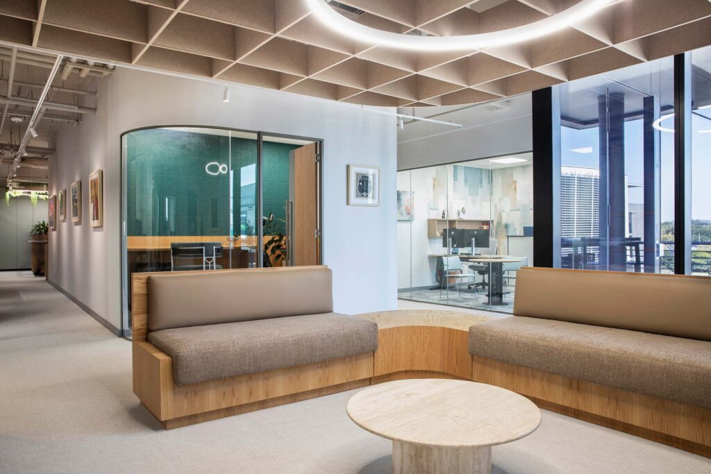 High end commercial office interior design with glass focus rooms for employees to focus at work