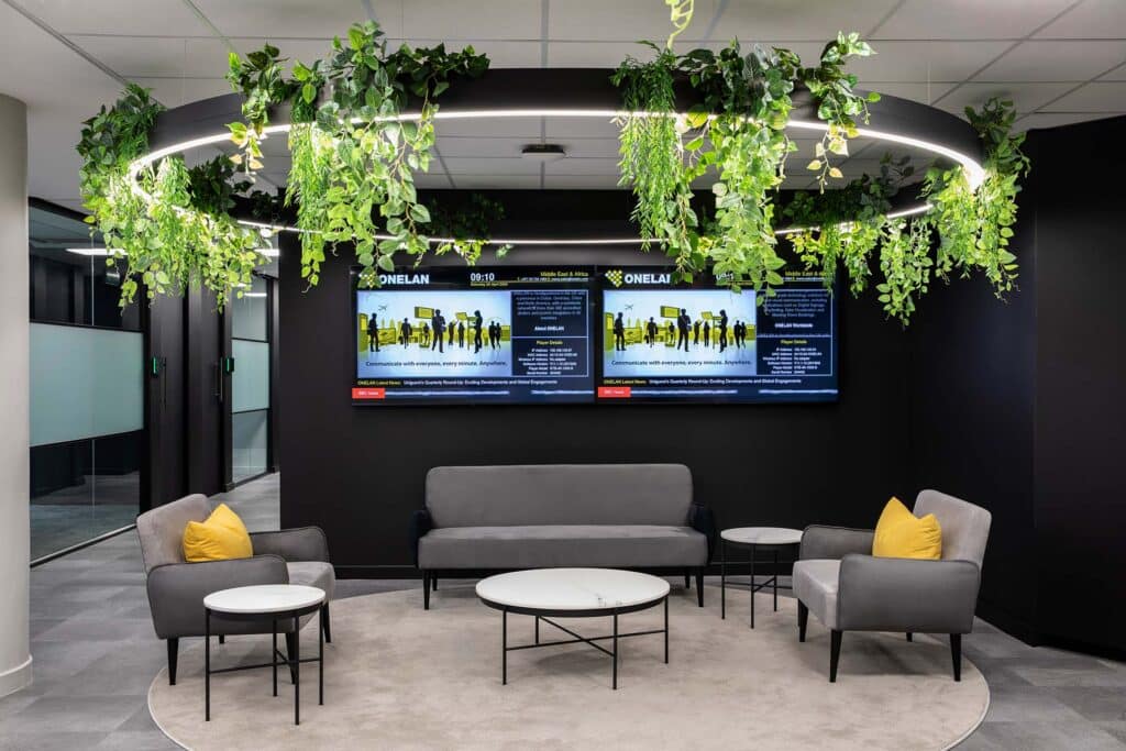 Commercial financial office workspace with high tech reception area with Tv screens installed